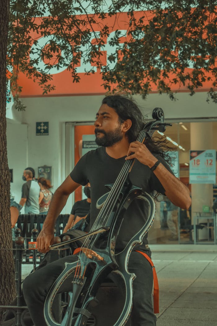 A talented street musician plays the cello with passion in Monterrey, Mexico.