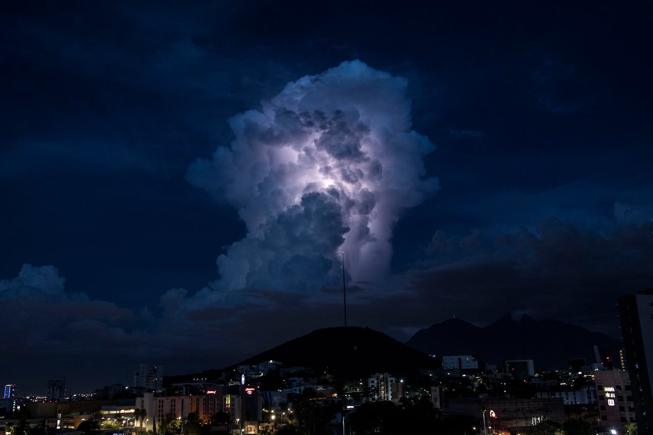 our-story A breathtaking view of a thunderstorm illuminating the night sky over Monterrey, Mexico.